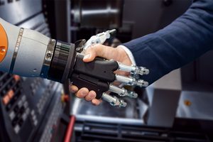 Hand of a businessman shaking hands with a Android robot. The concept of human interaction with artificial intelligence.